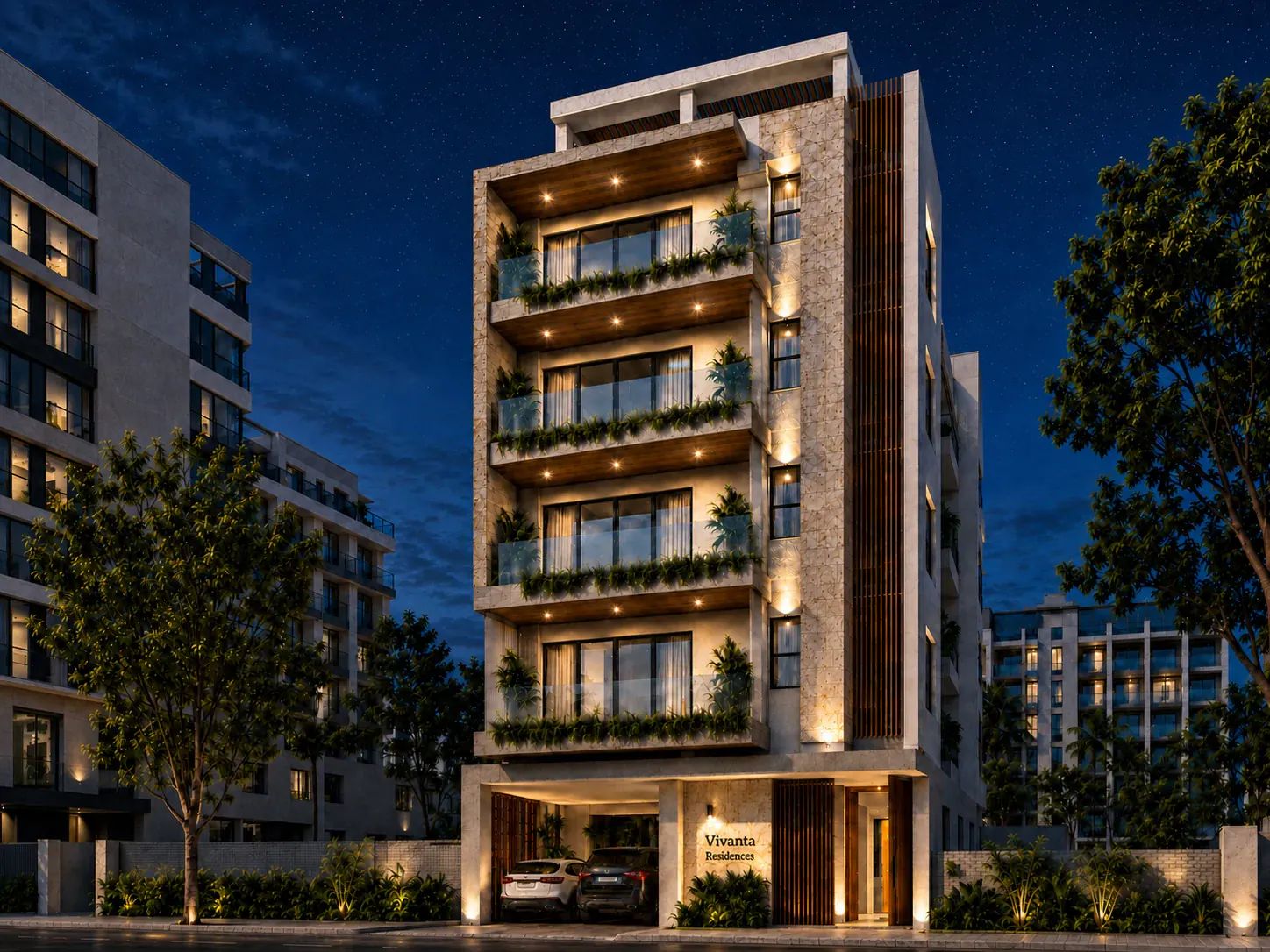 Dramatic night view of the residential building showing glowing up-lights and soft down-lights reflecting off the textured stone facade.